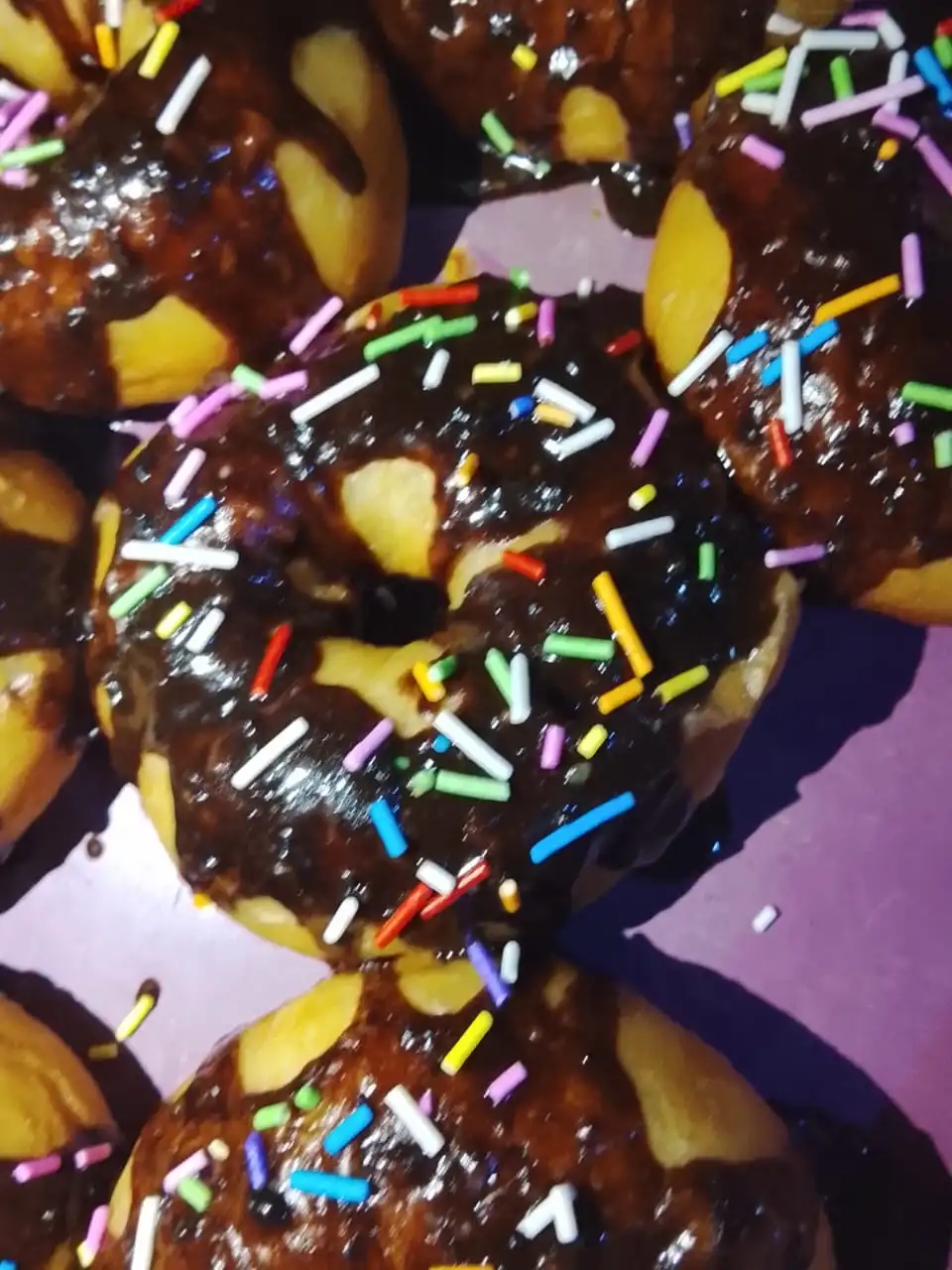 Richly coated chocolate donuts arranged nicely